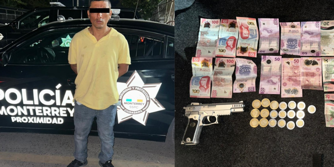 Man with eyes obscured standing beside a Monterrey police car; handgun and seized money laid out nearby.